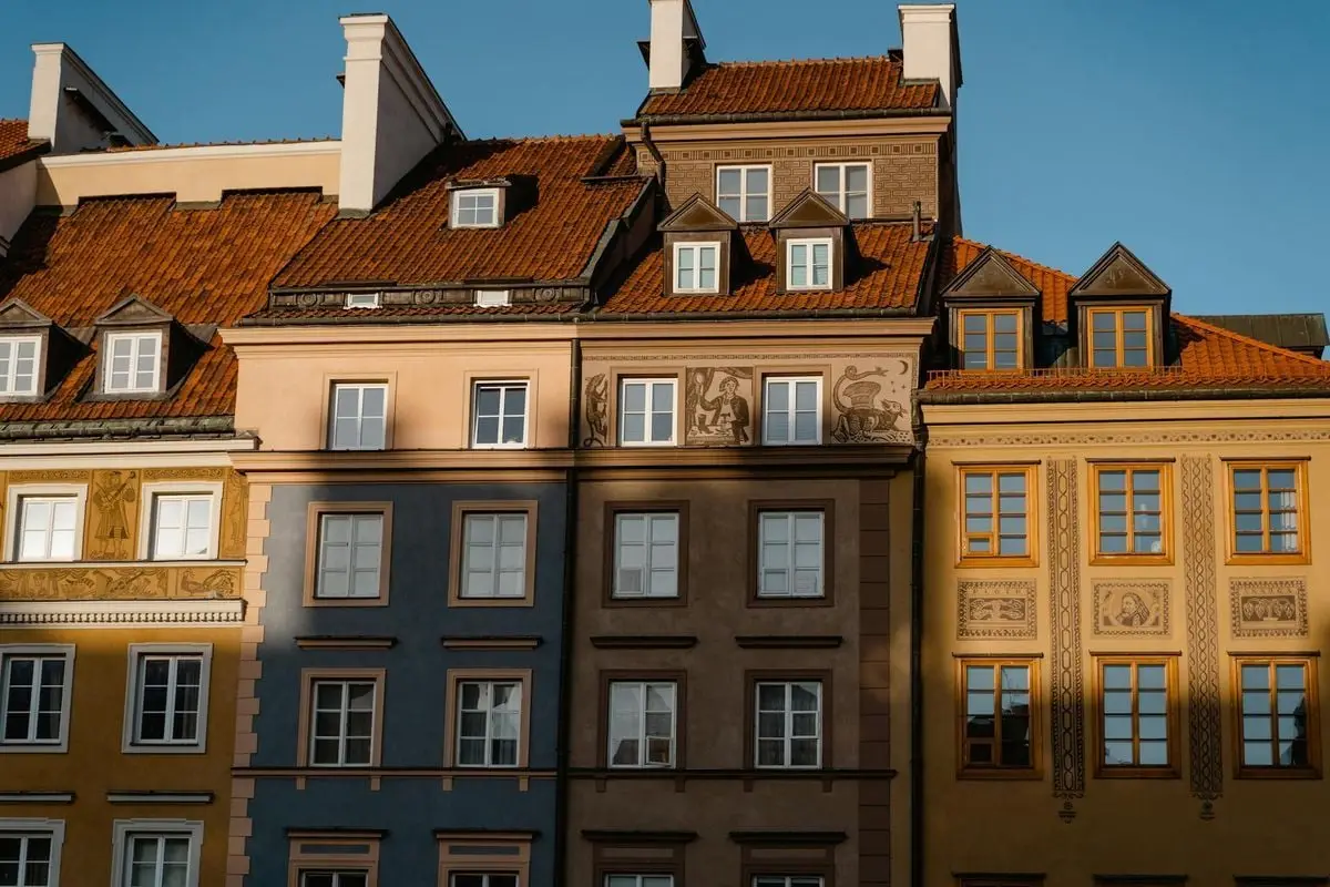 Vibrant old European facades showcasing architectural details under daylight in a historic urban setting.