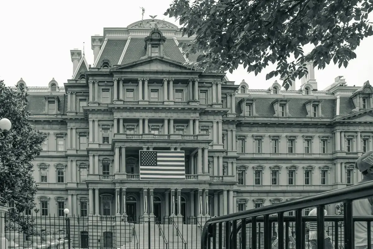View of the Eisenhower Executive Office Building in Washington with American flag.