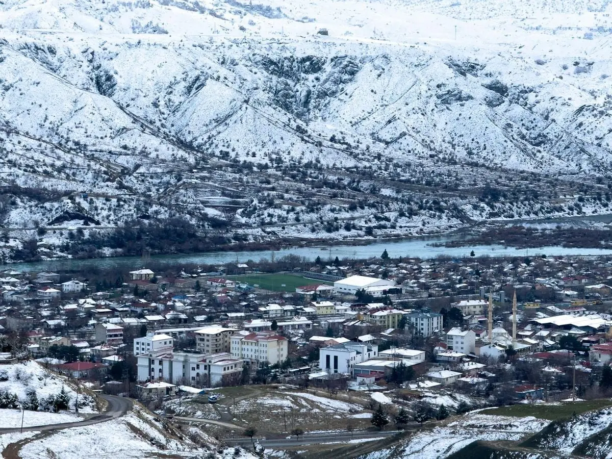 Aerial view of snow-covered Palu, Elazığ, Türkiye showcasing a picturesque winter landscape.