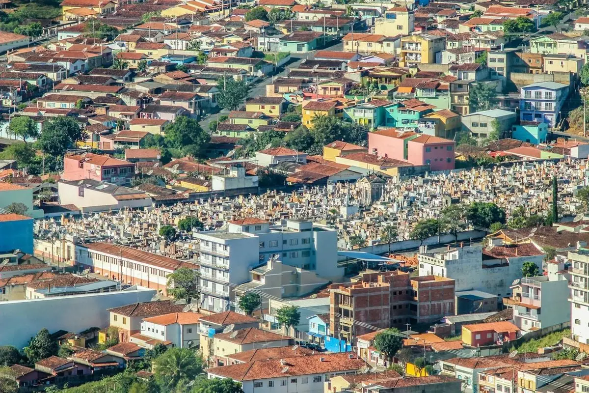A colorful aerial shot of Socorro, Brazil, showcasing vibrant rooftops and a cemetery.