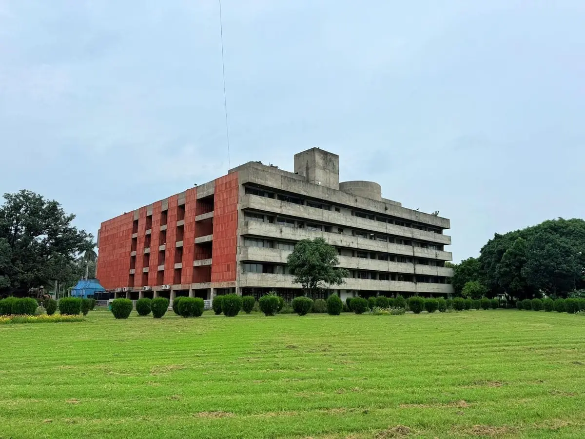 Concrete BR Ambedkar Administrative Building nestled in green garden, Chandigarh.