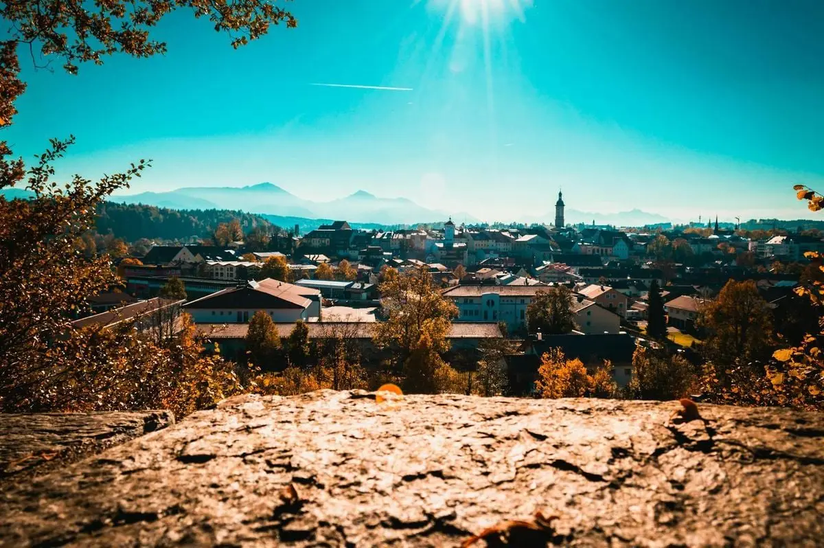 Beautiful panoramic view of Traunstein, Germany with mountains and sunrays in the autumn season.