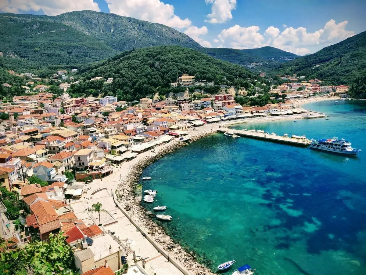 Stunning aerial view of Parga's vibrant coastline with clear blue waters and charming architecture in Greece.