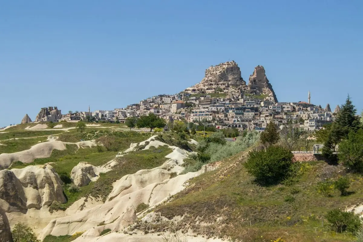 Discover the breathtaking landscape of Uchisar Castle in Cappadocia, Turkey, under a bright spring day.