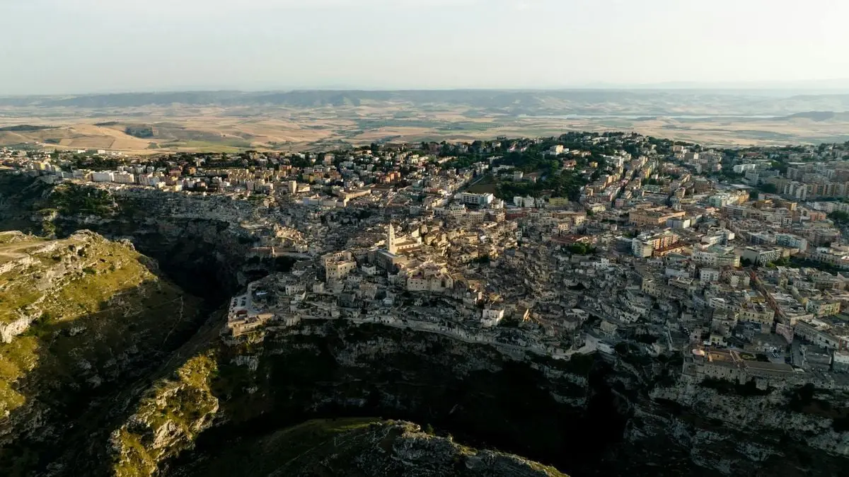 A stunning birds-eye view of Matera, Italy, showcasing its historic architecture and dramatic landscape.