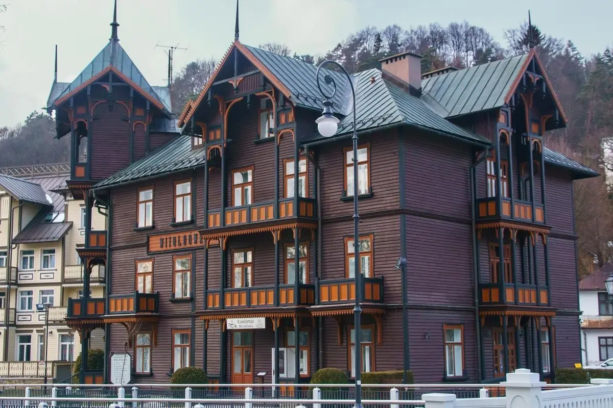 Beautiful traditional wooden architecture in Krynica-Zdrój, Poland, showcasing intricate design.