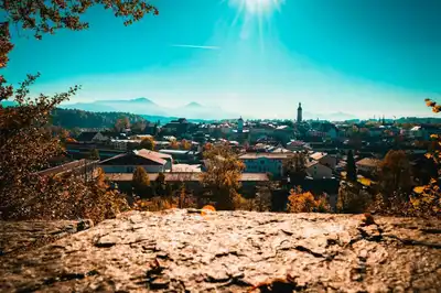 Beautiful panoramic view of Traunstein, Germany with mountains and sunrays in the autumn season.