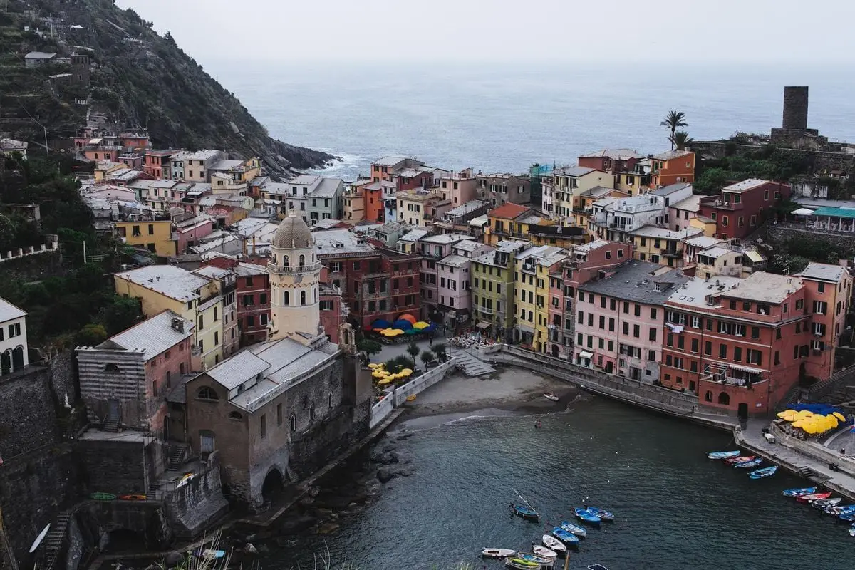 Aerial view of Vernazza's colorful buildings along the coast of Cinque Terre, Italy.