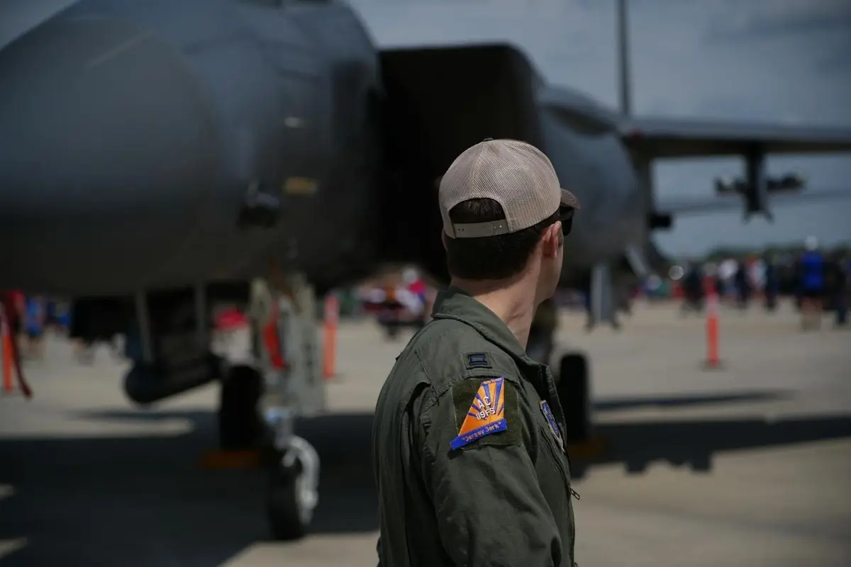 US Air Force fighter pilot standing near jet during airshow in Hampton, Virginia.