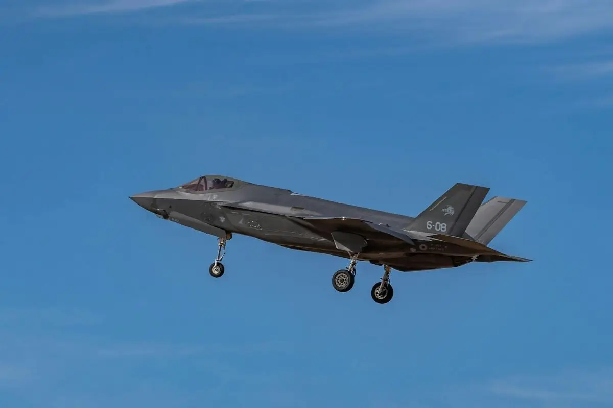 A sleek fighter jet soaring through a clear blue sky in Los Llanos, Spain.