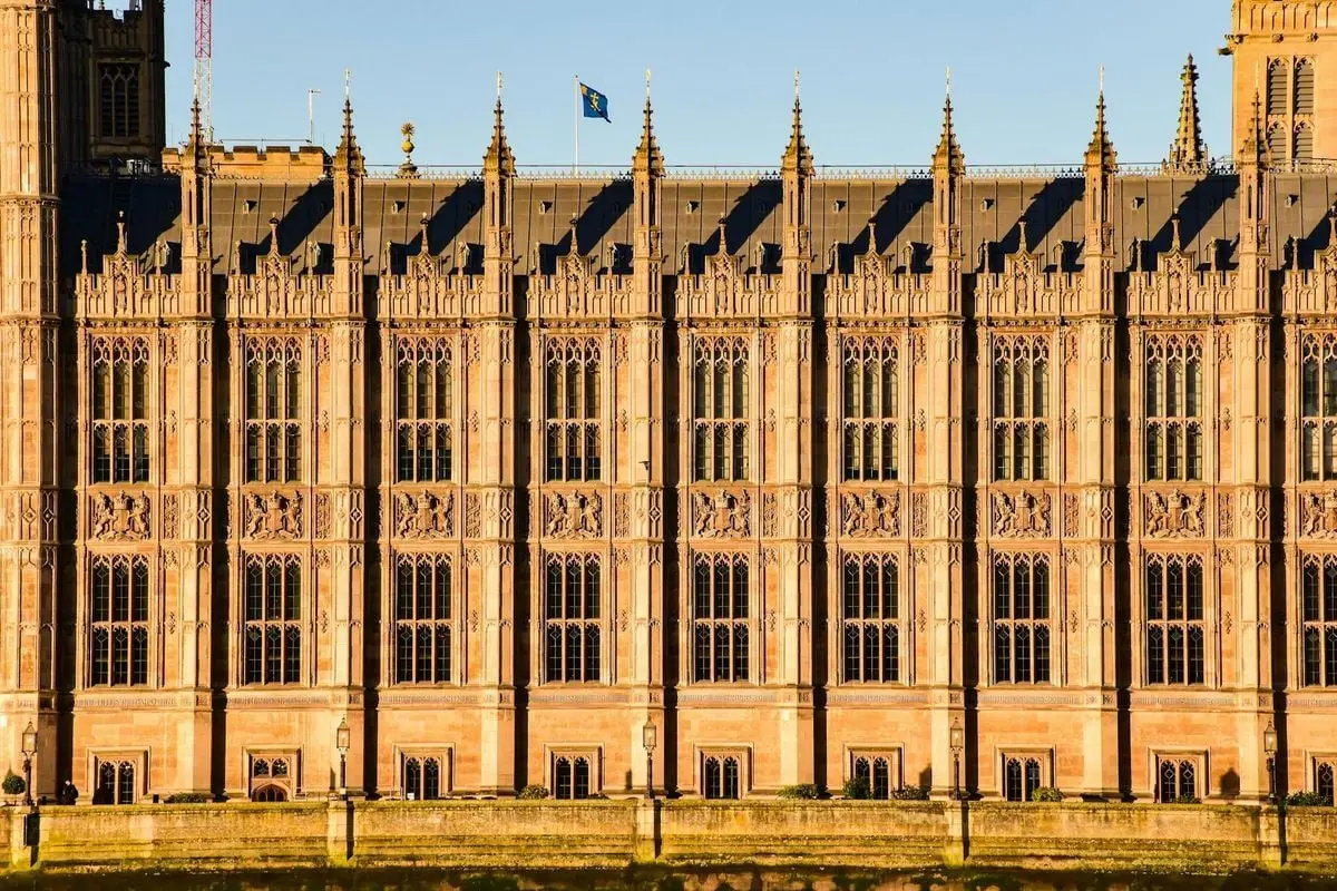 Close-up view of Westminster Palace's intricate Gothic architecture in London, UK.