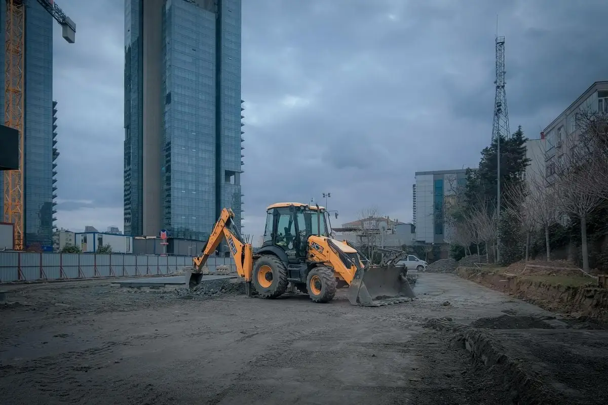 A vibrant urban construction site with excavator in Istanbul, Türkiye.