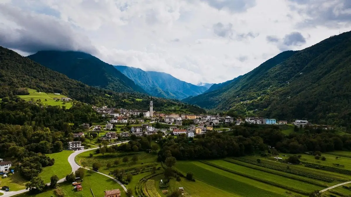 Explore the picturesque town of Seren del Grappa nestled in lush Italian mountains.