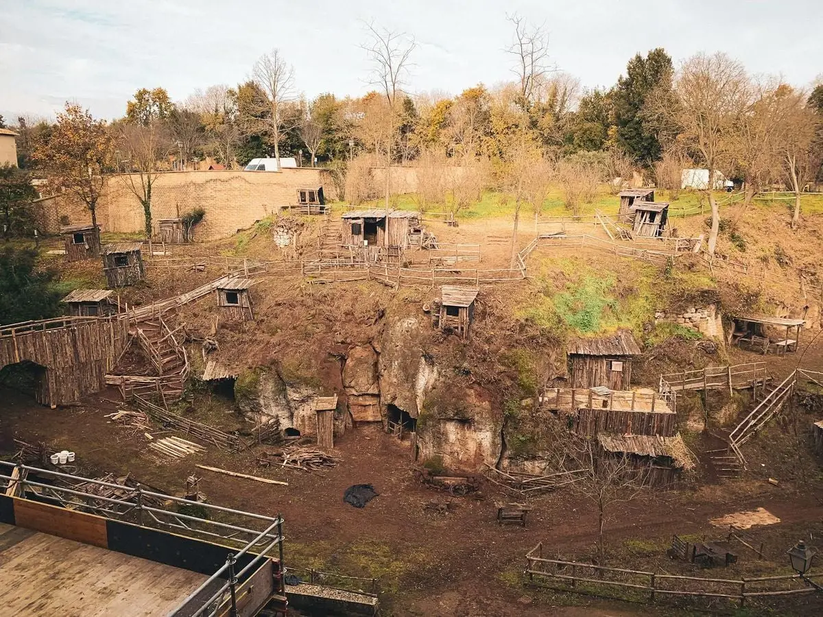 Explore the rustic wooden village inspired by medieval architecture in Corchiano, Italy.