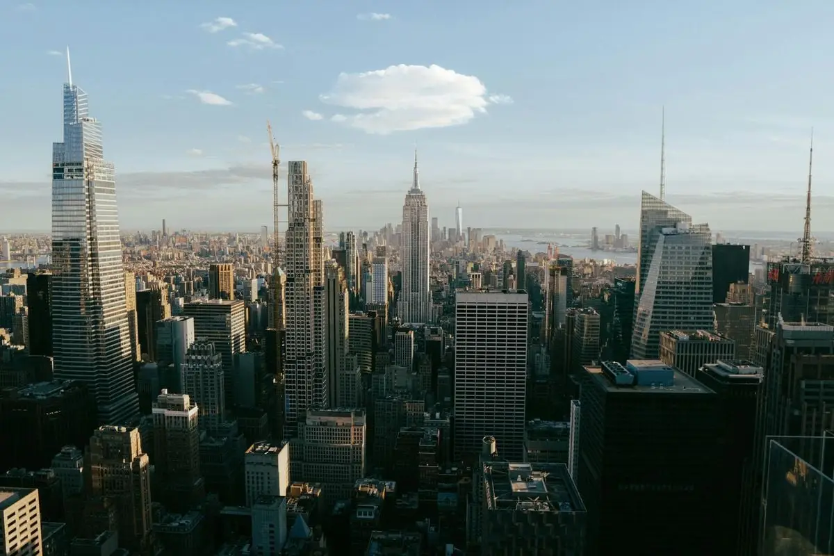 A stunning panoramic view of the New York City skyline featuring iconic skyscrapers at day.