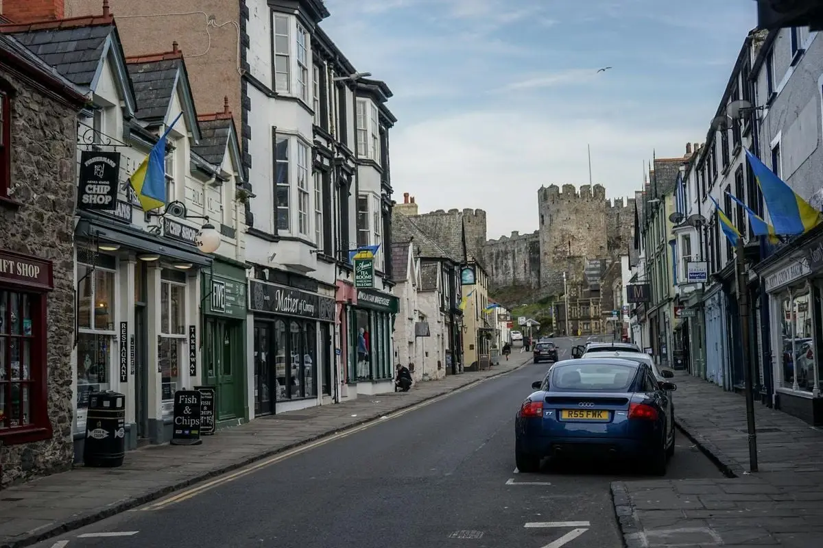 Explore the picturesque streets of medieval Conwy, Wales, captured with iconic castle views.