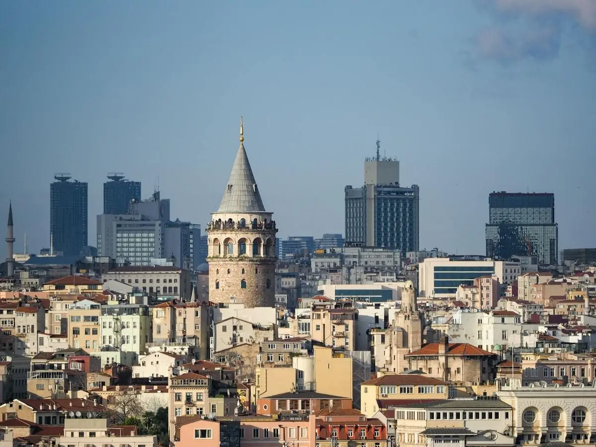 A breathtaking aerial view of the iconic Galata Tower amidst Istanbul's vibrant cityscape.