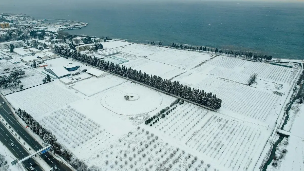 Aerial view of snow-covered landscape in Yalova, Turkey by the coast.