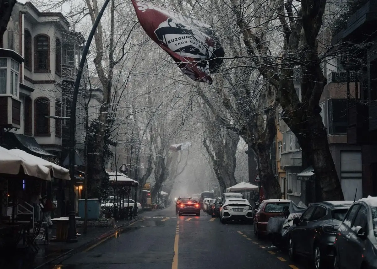 A snowy street scene in Kuzguncuk, Istanbul with moody atmosphere and architectural charm.