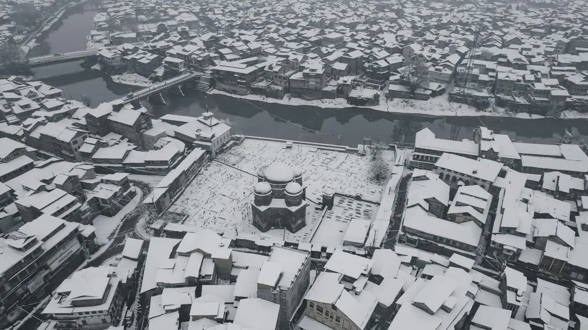 Snow blankets the historic buildings of Srinagar, showcasing its unique winter charm from above.