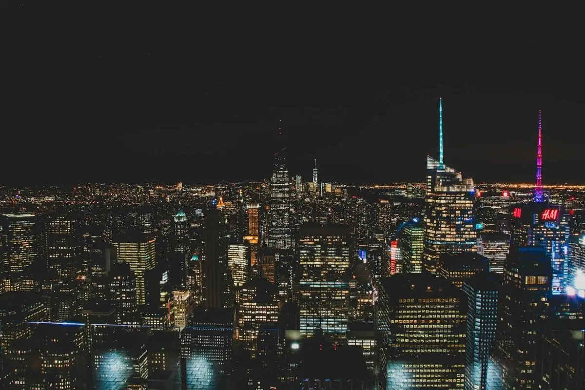 A breathtaking aerial view of New York City's illuminated skyline at night.