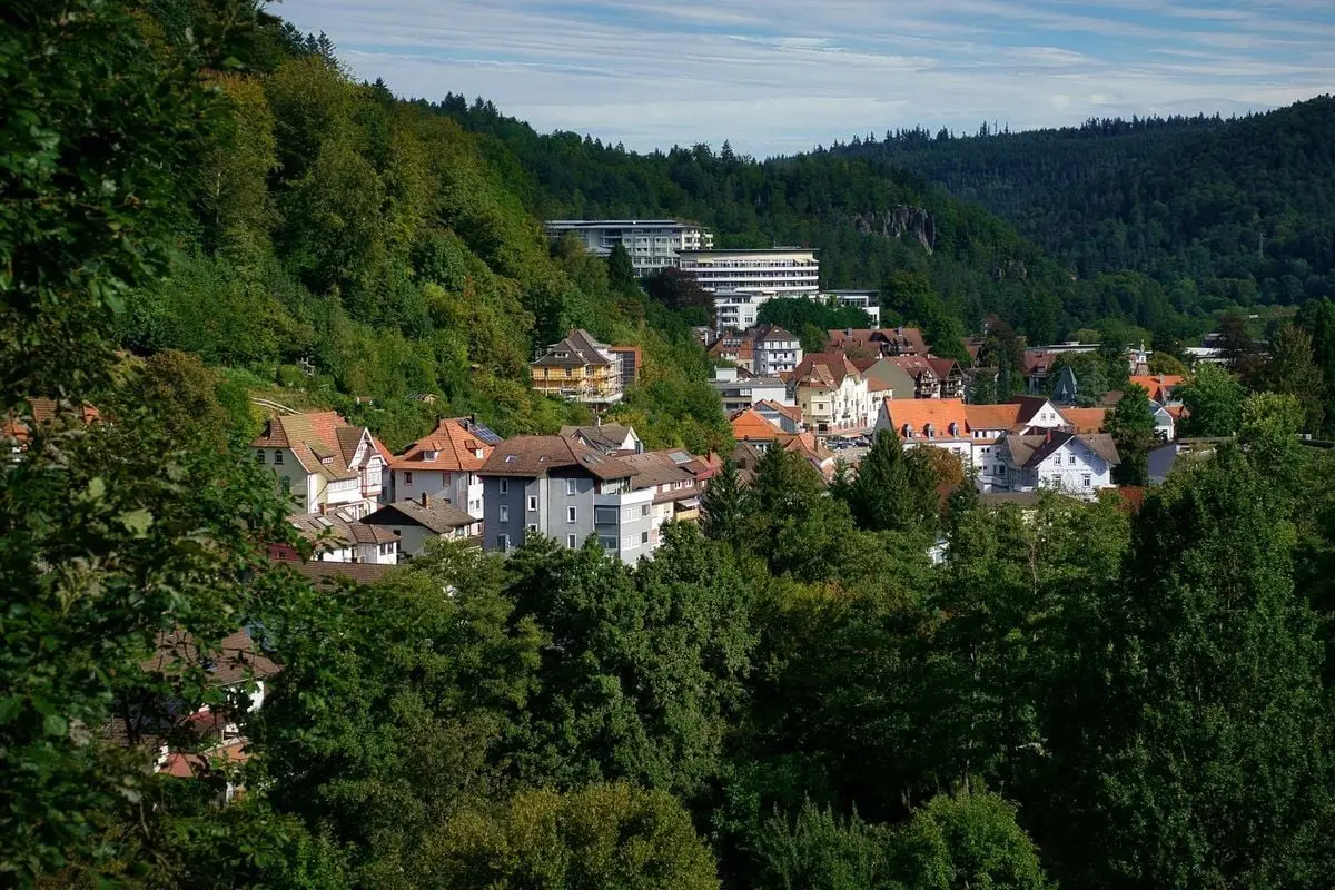 Scenic view of Bad Herrenalb, Germany with lush greenery and traditional architecture.