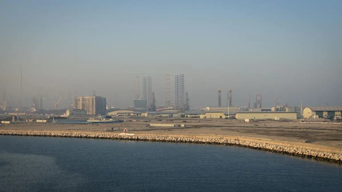 A panoramic view of Dubai's industrial waterfront with modern buildings.