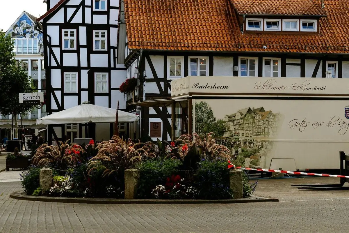 Picturesque view of traditional half-timbered buildings in a quaint German town square.