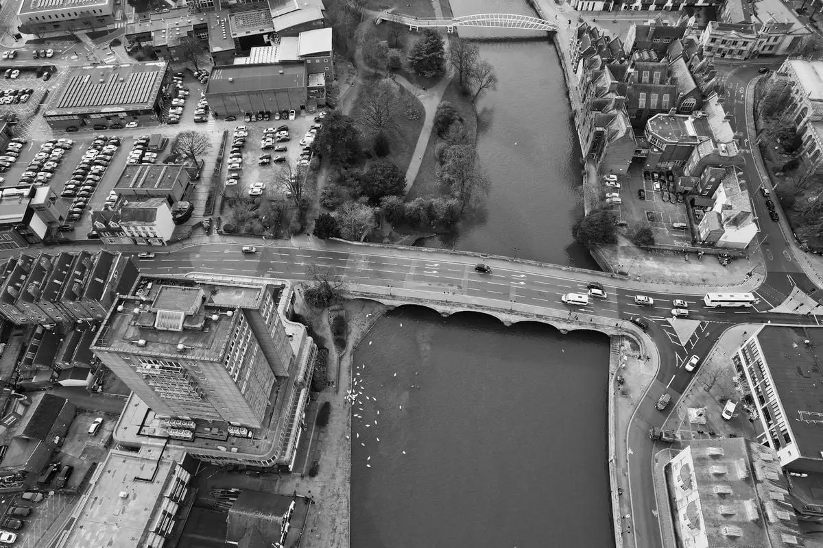 Explore the stunning aerial view of Bedford's urban landscape and historic bridges.