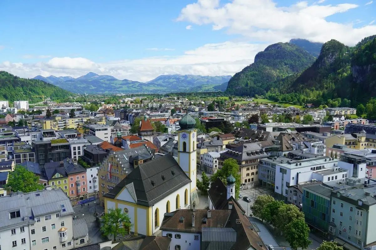 A stunning aerial view of Kufstein, Austria showcasing the town's architecture and mountainous landscape.