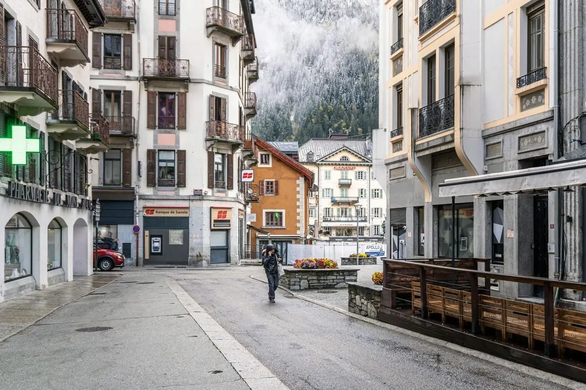 Explore the picturesque winter streets of Chamonix, France, with stunning alpine views.