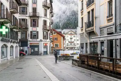 Explore the picturesque winter streets of Chamonix, France, with stunning alpine views.
