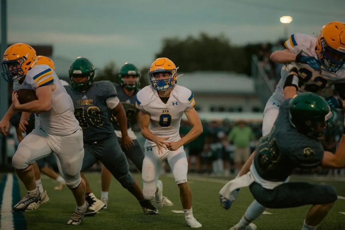 Intense moment of players in action during a high school football game.