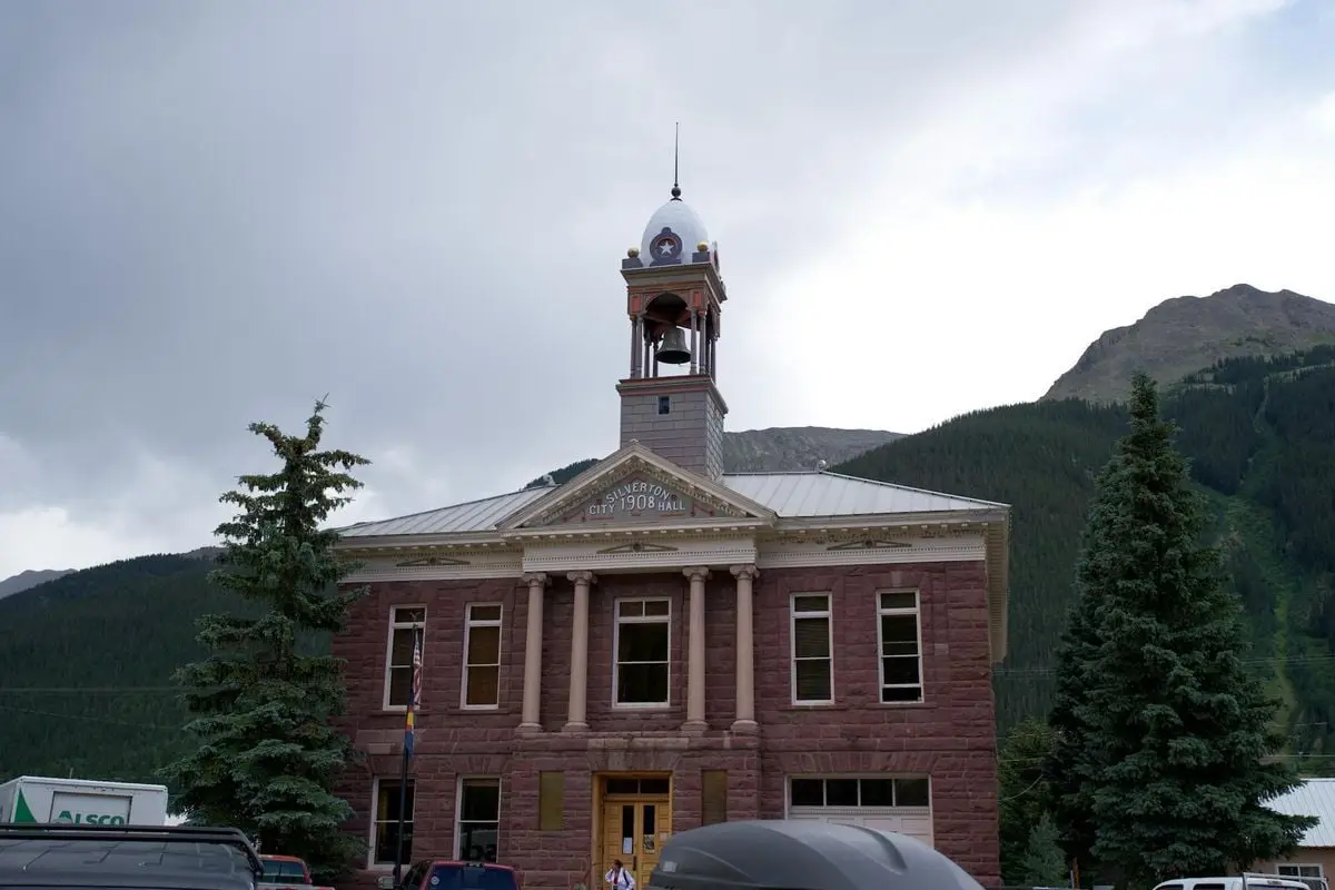 Silverton City Hall against mountain backdrop, an iconic landmark with architectural charm.