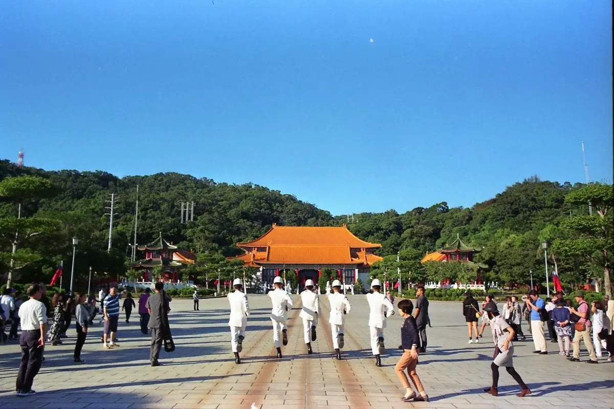 Soldiers perform the changing of the guard in front of visitors in Taipei's scenic memorial plaza.