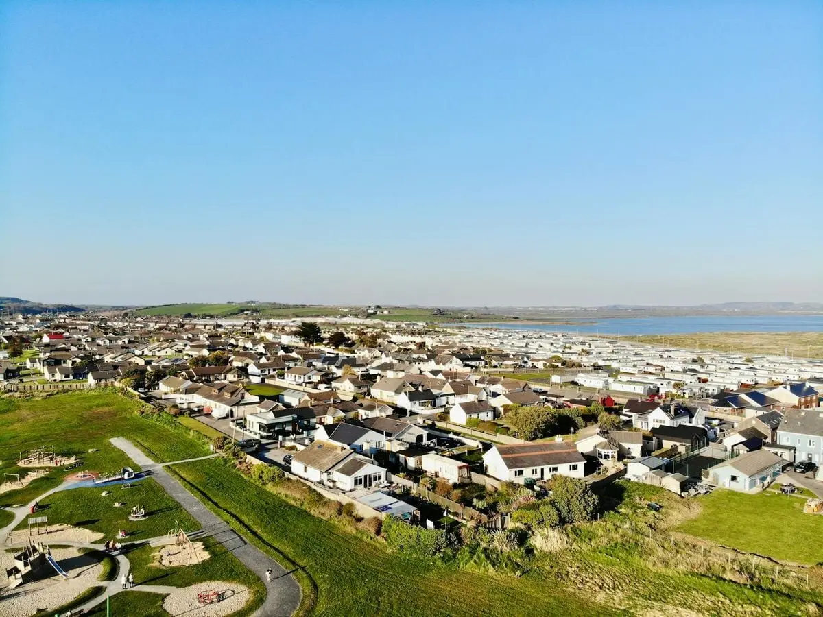Scenic aerial view of Tramore, County Waterford, Ireland, showcasing residential area and coastline.