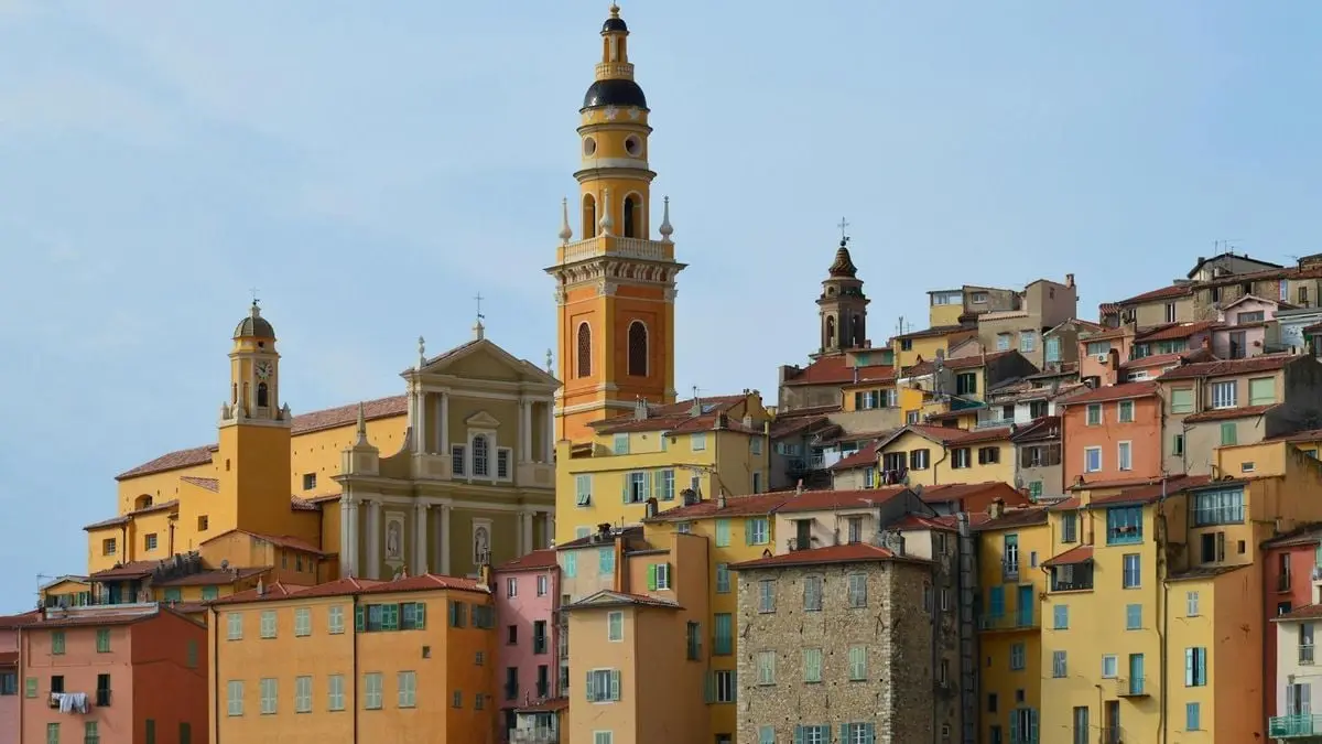 Scenic view of colorful buildings and church towers in Mediterranean town.