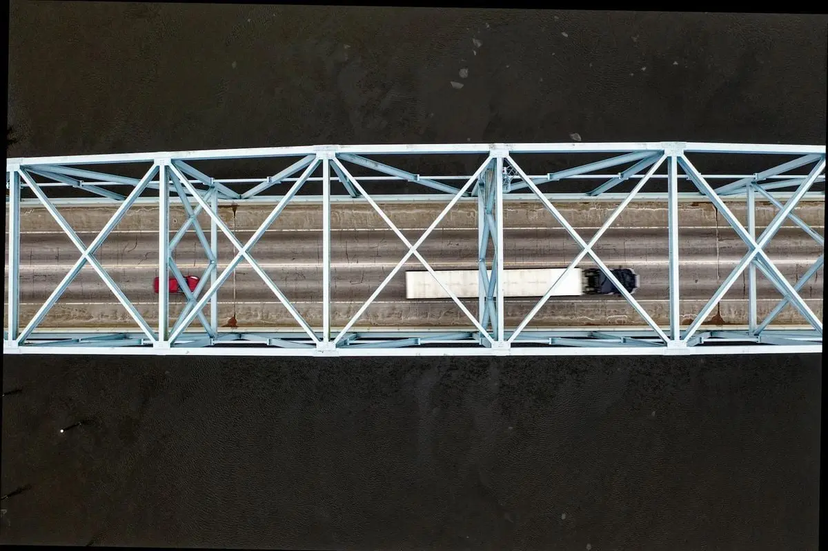 Aerial view of vehicles crossing a bridge in Wabasha, Minnesota over a river.