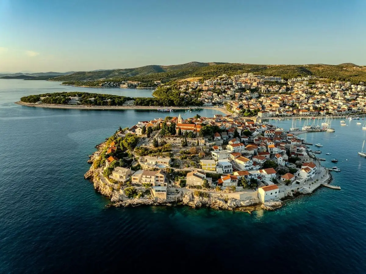 Stunning aerial view of Primošten peninsula and azure sea from above.