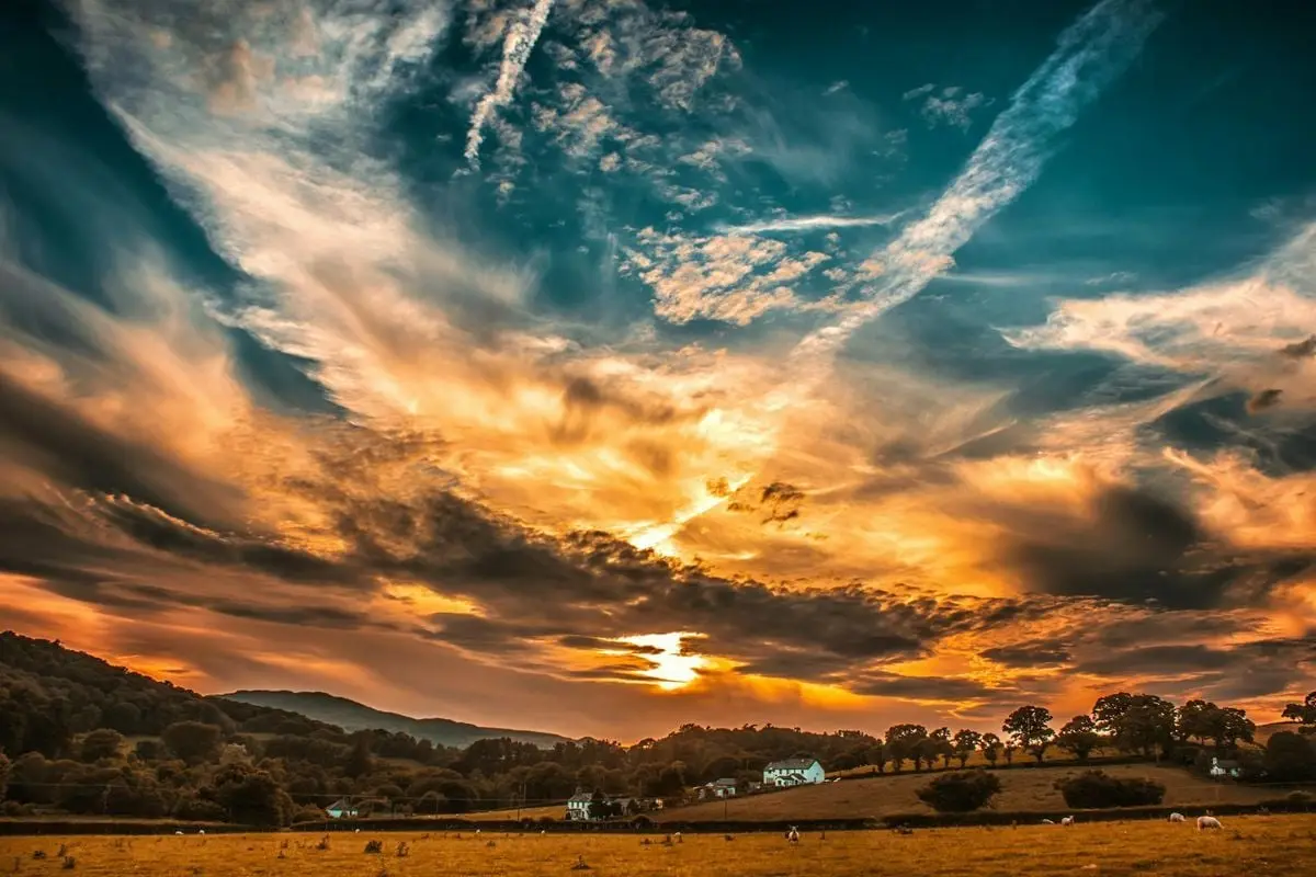 Breathtaking sunset in Conwy, Wales with colorful skies over a rural landscape. Perfect for nature and travel themes.