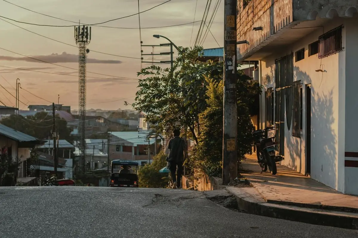 A peaceful evening street scene in Yurimaguas, Peru, capturing the urban ambiance at sunset.