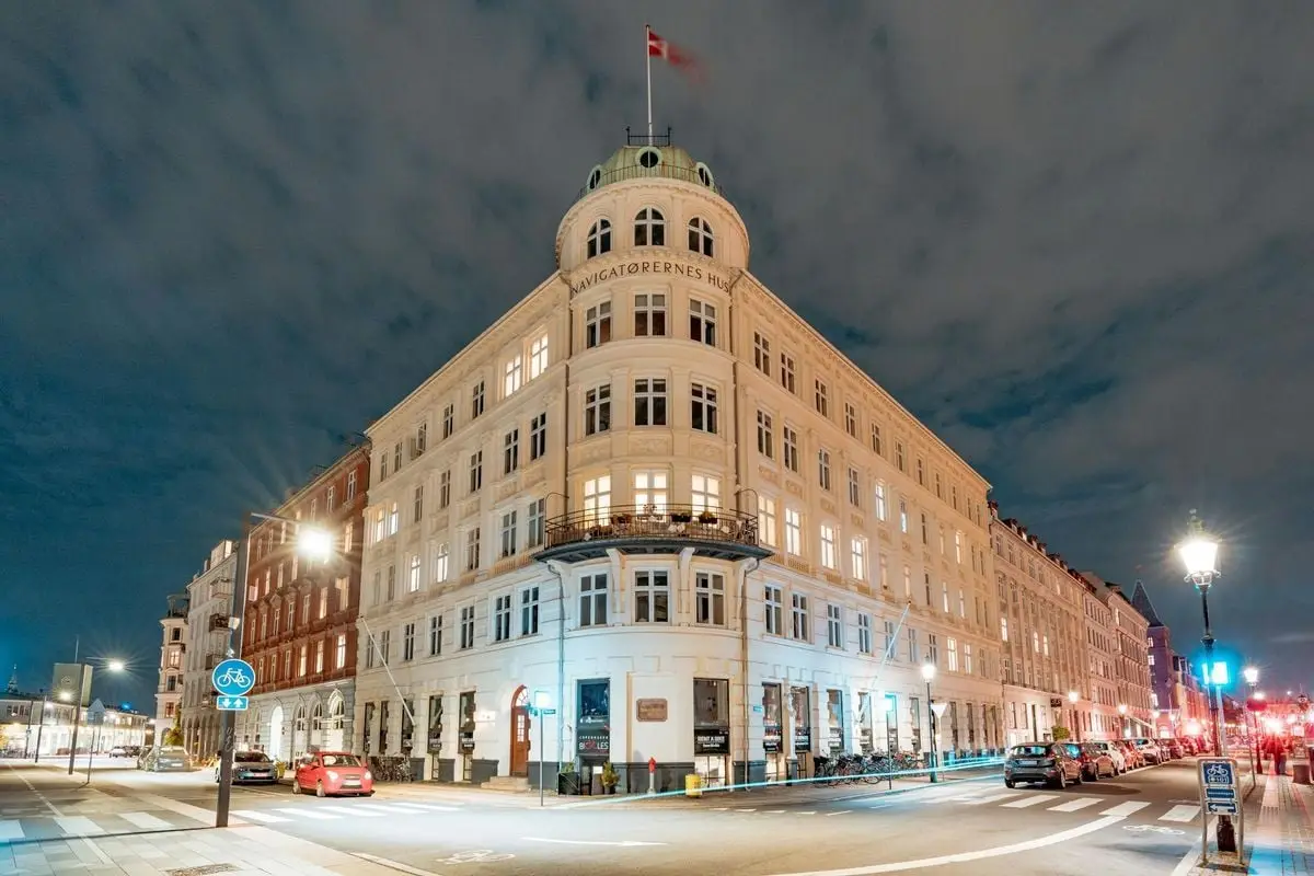 Captivating night view of the illuminated Navigatorernes Building in Copenhagen, Denmark.