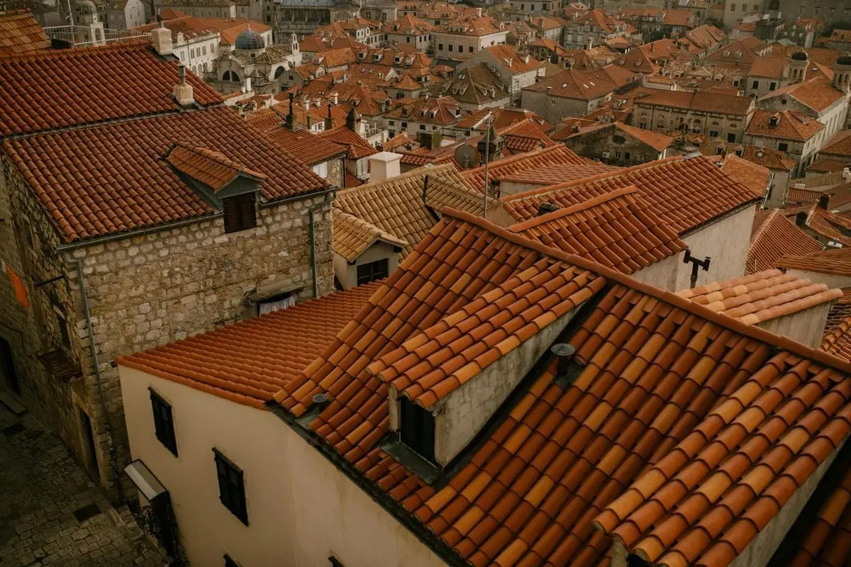 Stunning aerial view of Dubrovnik's iconic terracotta rooftops, capturing medieval architectural charm.