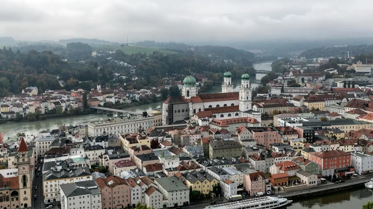 Scenic aerial view of Passau, Bavaria showcasing beautiful architecture by the rivers.