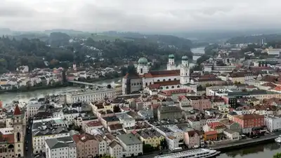 Scenic aerial view of Passau, Bavaria showcasing beautiful architecture by the rivers.