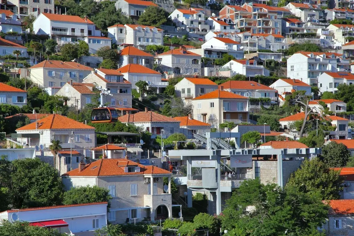 Explore the picturesque hillside houses with vibrant red roofs in Dubrovnik, Croatia.