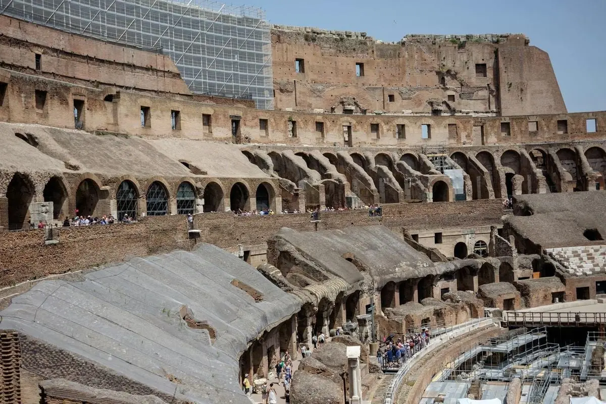 Explore the ancient ruins of the Colosseum, a historic landmark in Rome, Italy, showcasing its impressive architecture.