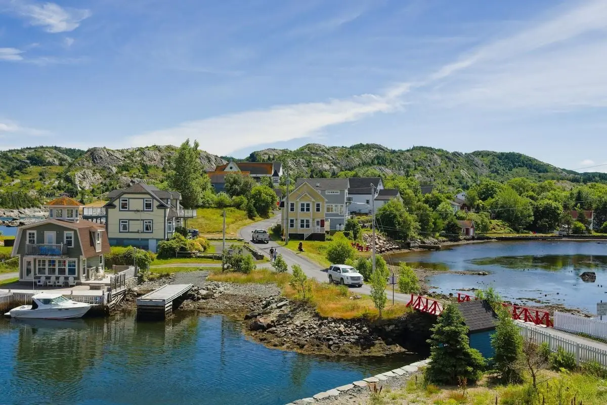Scenic view of Brigus, a charming coastal village in Newfoundland, Canada, with colorful houses by the waterfront.