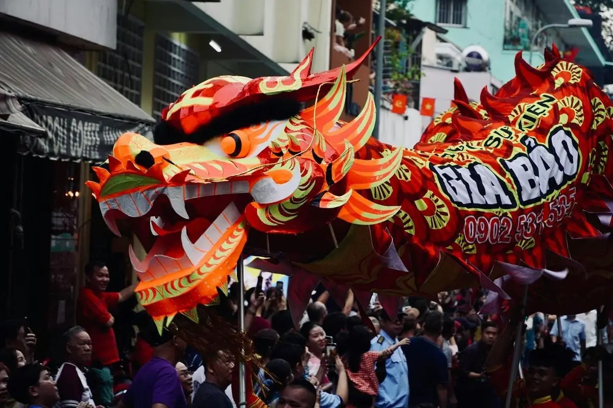 Colorful dragon parade during a traditional festival, showcasing cultural heritage.
