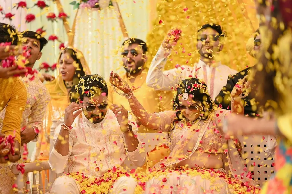 Joyful Indian wedding ceremony with colorful flower petals, vibrant traditions, and festive atmosphere.